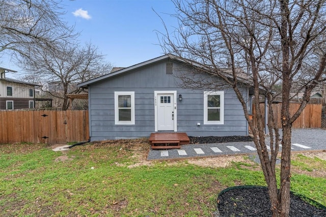 1802 Webberville Rd, Austin, TX 78721 - view of front of house featuring fence and a front lawn