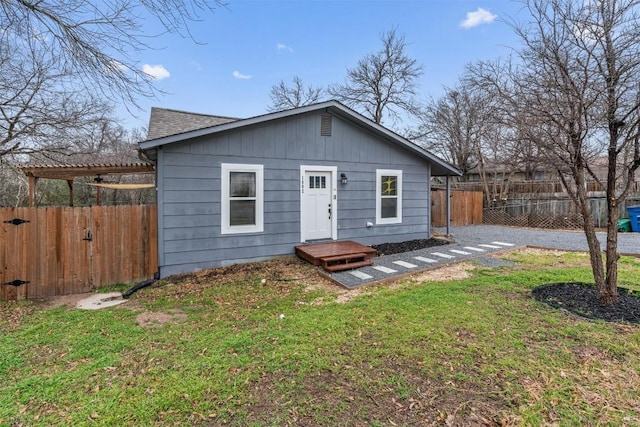 1802 Webberville Rd, Austin, TX 78721 - view of front of house with roof with shingles, fence private yard, and a front yard