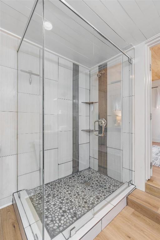 1802 Webberville Rd, Austin, TX 78721 - full bath featuring a stall shower and wood finished floors