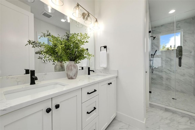 bathroom featuring visible vents, a sink, marble finish floor, and a marble finish shower
