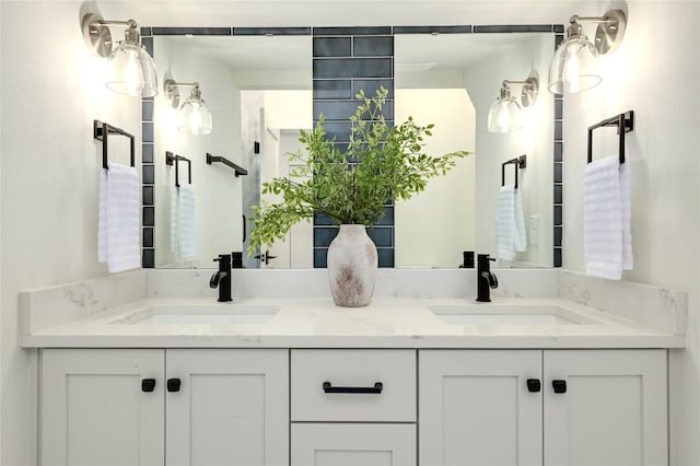 full bath featuring a sink and double vanity