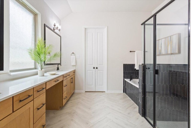 full bathroom featuring a garden tub, lofted ceiling, a stall shower, and vanity