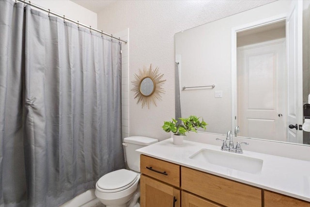 full bathroom with toilet, curtained shower, and vanity