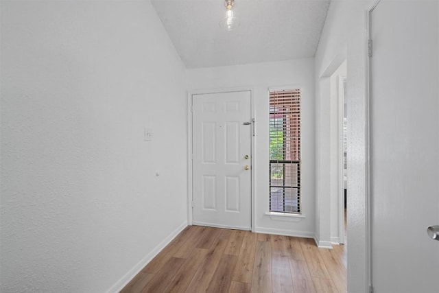 1601 Faro Dr Unit 1102, Austin, TX 78741 - foyer entrance featuring baseboards and light wood-style flooring
