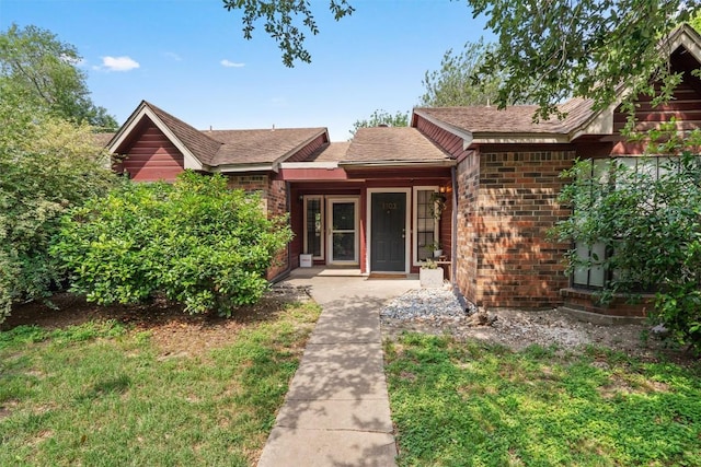 1601 Faro Dr Unit 1102, Austin, TX 78741 - exterior space with brick siding and a shingled roof