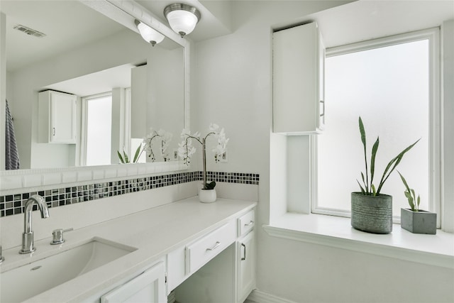 4015 Alexandria Dr, Austin, TX 78749 - bathroom featuring backsplash and vanity