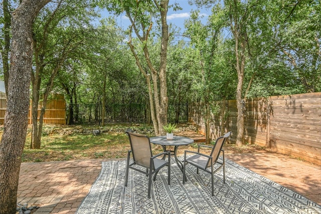 4015 Alexandria Dr, Austin, TX 78749 - fenced backyard with a patio and outdoor dining area