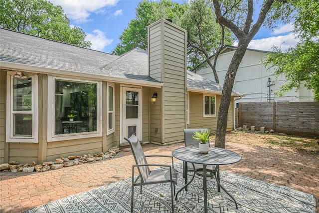 view of patio featuring fence