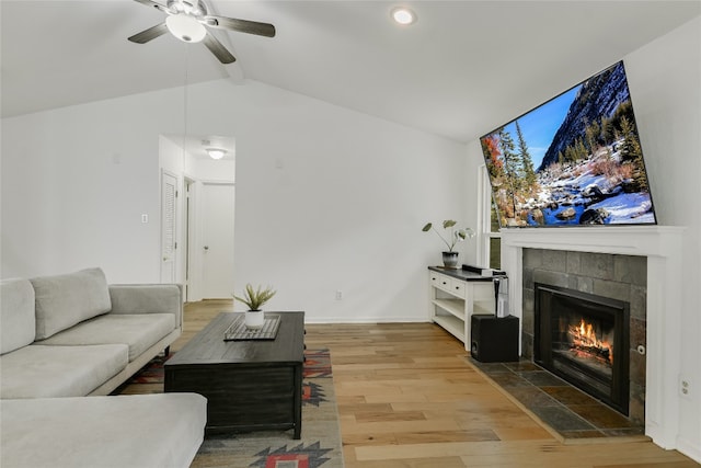 living room featuring ceiling fan, wood finished floors, a tile fireplace, recessed lighting, and baseboards