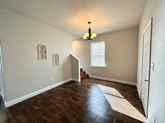 interior space featuring baseboards, dark wood-style flooring, stairs, and a chandelier