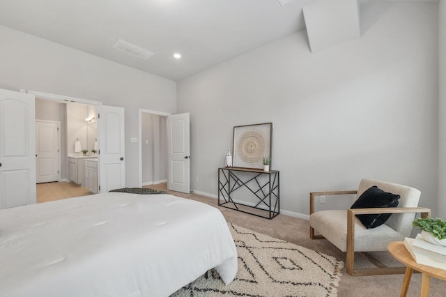 bedroom featuring visible vents, baseboards, and light carpet