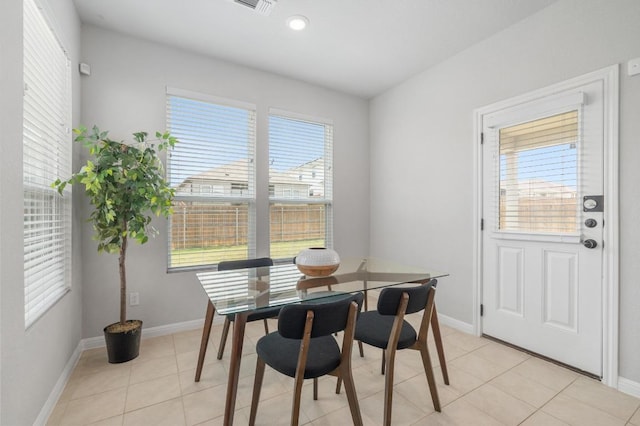 dining room with recessed lighting, baseboards, and light tile patterned floors