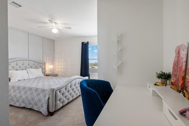 bedroom featuring visible vents, carpet floors, and ceiling fan