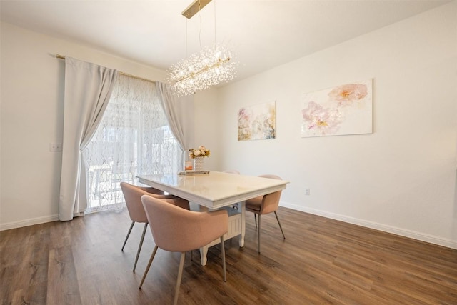dining room featuring baseboards, dark wood-style flooring, and a chandelier
