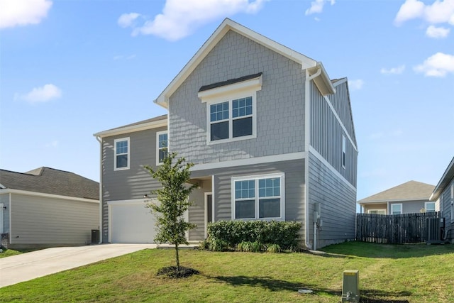 traditional-style house with fence, an attached garage, a front lawn, central AC unit, and concrete driveway