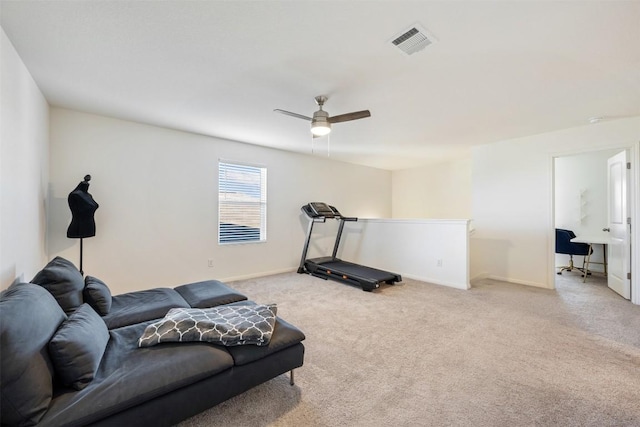 workout area featuring visible vents, carpet flooring, baseboards, and ceiling fan