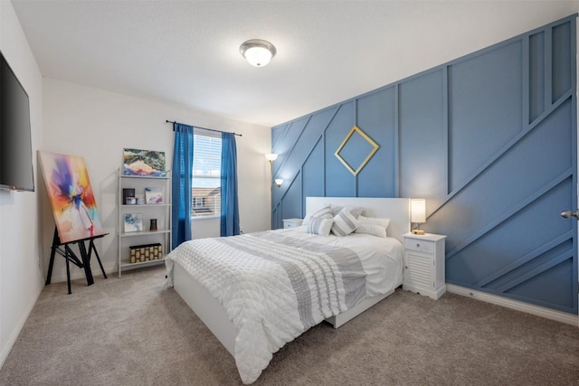 carpeted bedroom featuring baseboards