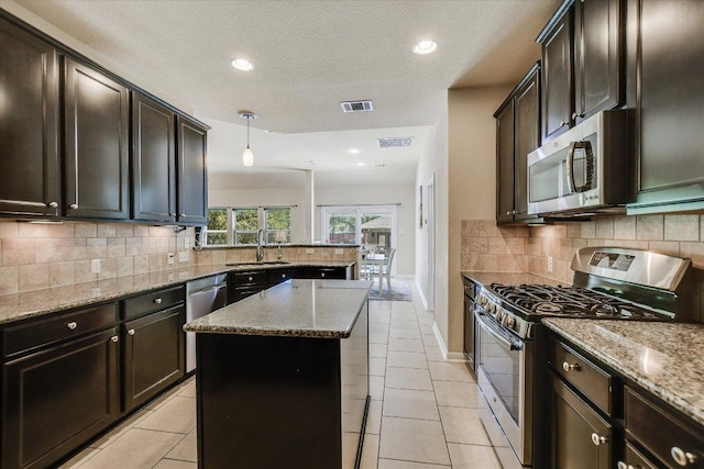 1901 Meandering Meadows Dr, Pflugerville, TX 78660 - kitchen featuring visible vents, appliances with stainless steel finishes, and light tile patterned flooring