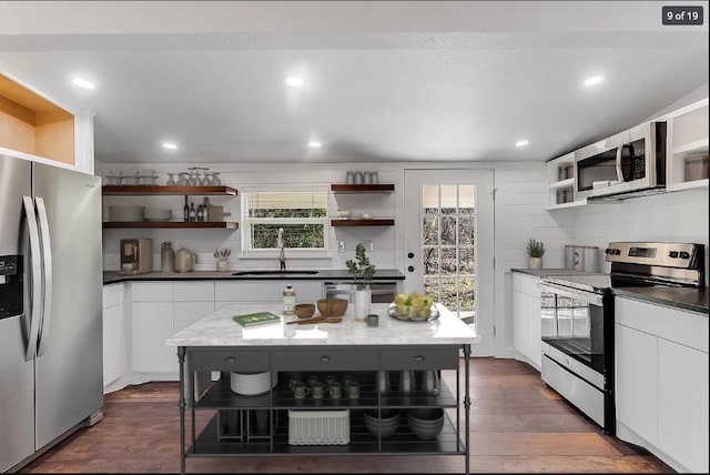 704 Sheffield Ave, Llano, TX 78654 - kitchen featuring white cabinets, stainless steel appliances, open shelves, and a sink
