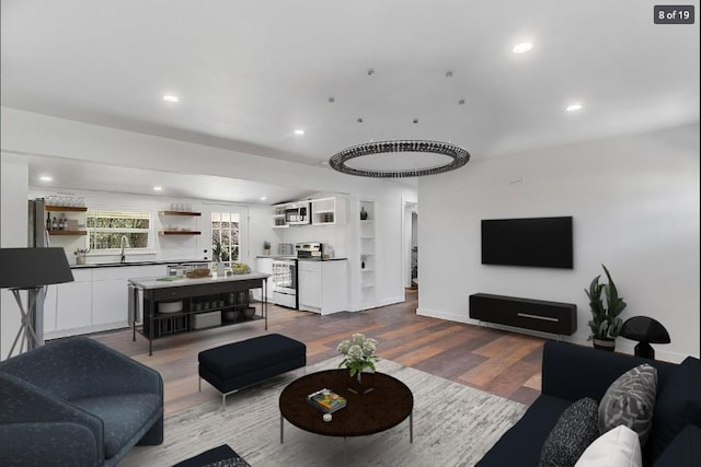 704 Sheffield Ave, Llano, TX 78654 - living room with recessed lighting, baseboards, and dark wood-type flooring
