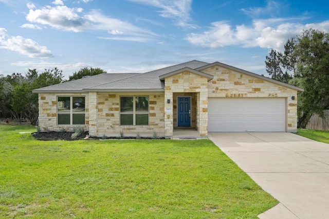 5407 Thunderbird St, Lago Vista, TX 78645 - view of front of property with a front yard, stone siding, and a garage
