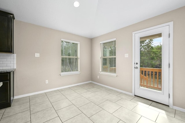 5407 Thunderbird St, Lago Vista, TX 78645 - unfurnished dining area with baseboards and a wealth of natural light