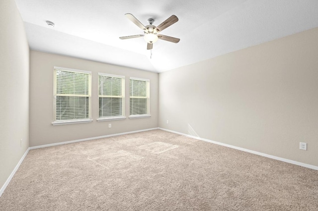 5407 Thunderbird St, Lago Vista, TX 78645 - unfurnished room with a healthy amount of sunlight, carpet floors, baseboards, and a ceiling fan