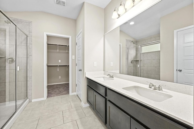 5407 Thunderbird St, Lago Vista, TX 78645 - full bath with visible vents, a sink, vaulted ceiling, and a stall shower