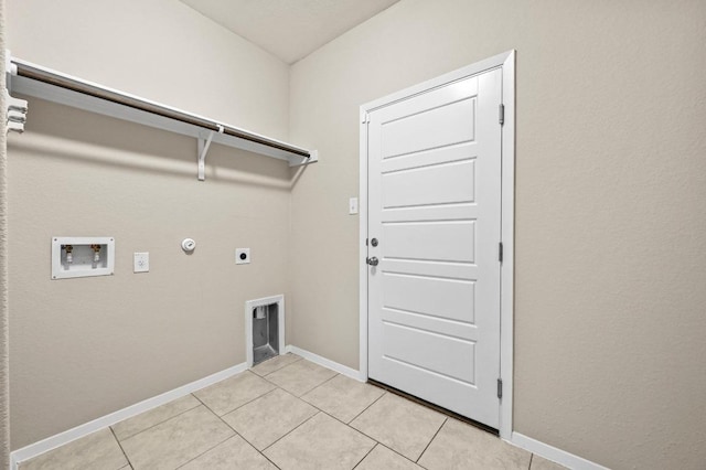 5407 Thunderbird St, Lago Vista, TX 78645 - clothes washing area with hookup for an electric dryer, laundry area, hookup for a gas dryer, hookup for a washing machine, and light tile patterned flooring