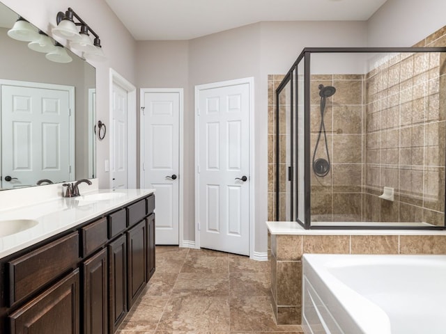 2040 Elaina Loop, Leander, TX 78641 - bathroom with a shower stall, double vanity, and a garden tub