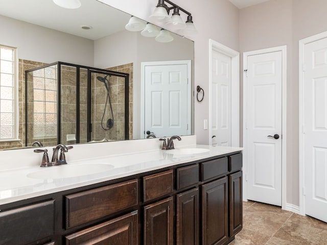 2040 Elaina Loop, Leander, TX 78641 - full bathroom featuring a shower stall and double vanity