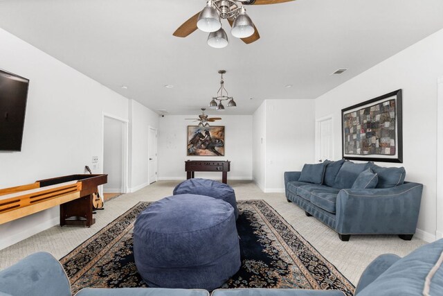 playroom with ceiling fan, visible vents, light carpet, and baseboards