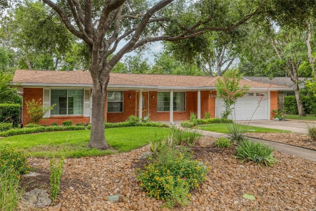 7300 Greenhaven Dr, Austin, TX 78757 - single story home featuring brick siding, a garage, driveway, and a front lawn