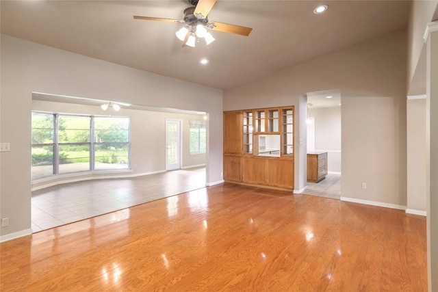 7300 Greenhaven Dr, Austin, TX 78757 - spare room with baseboards, ceiling fan, wood finished floors, recessed lighting, and high vaulted ceiling