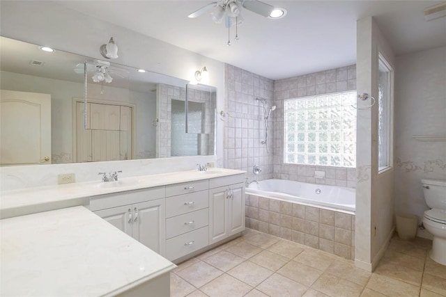 7300 Greenhaven Dr, Austin, TX 78757 - bathroom featuring ceiling fan, toilet, tile patterned flooring, double vanity, and recessed lighting