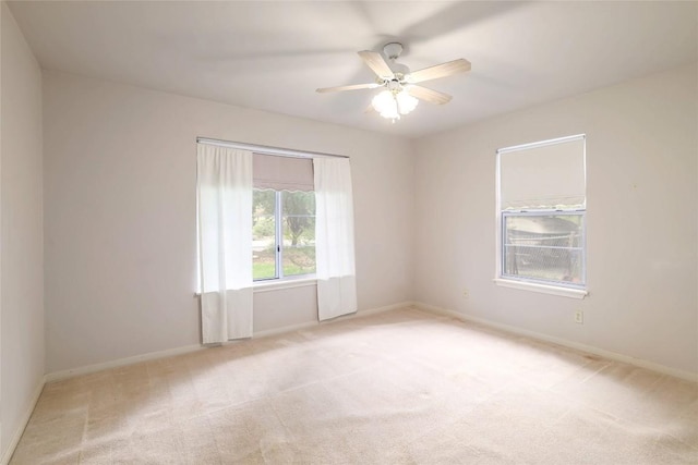 7300 Greenhaven Dr, Austin, TX 78757 - unfurnished room featuring light colored carpet, a ceiling fan, and baseboards