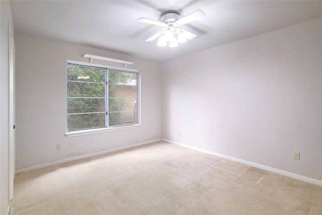 7300 Greenhaven Dr, Austin, TX 78757 - unfurnished room featuring light carpet, baseboards, and ceiling fan