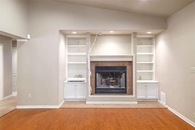 7300 Greenhaven Dr, Austin, TX 78757 - unfurnished living room featuring wood finished floors, a fireplace, baseboards, and recessed lighting