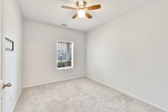 240 Olympic Park Dr, Kyle, TX 78640 - carpeted spare room featuring baseboards, a ceiling fan, and visible vents