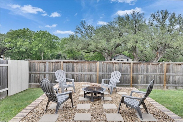 240 Olympic Park Dr, Kyle, TX 78640 - view of patio featuring a fenced backyard and an outdoor fire pit