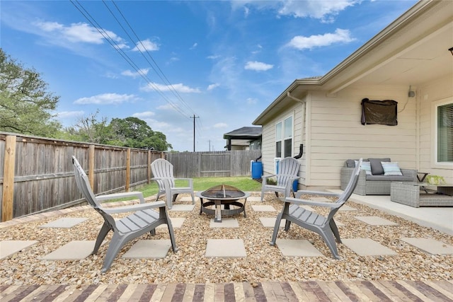 240 Olympic Park Dr, Kyle, TX 78640 - view of patio with a fenced backyard and an outdoor fire pit