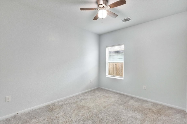 240 Olympic Park Dr, Kyle, TX 78640 - unfurnished room with carpet flooring, baseboards, visible vents, and ceiling fan