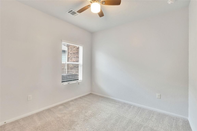 240 Olympic Park Dr, Kyle, TX 78640 - unfurnished room with visible vents, a ceiling fan, baseboards, and light carpet
