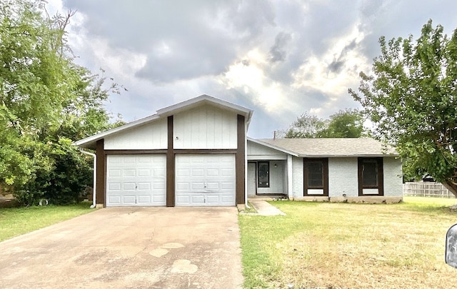 10810 Calcite Trl, Austin, TX 78750 - view of front of property featuring brick siding, a garage, a front lawn, and driveway