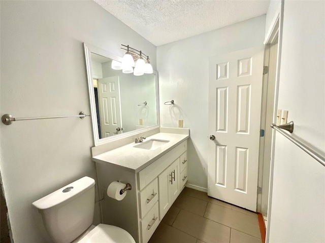 10810 Calcite Trl, Austin, TX 78750 - half bathroom featuring tile patterned flooring, a textured ceiling, toilet, and vanity