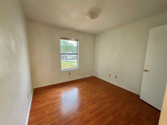 10810 Calcite Trl, Austin, TX 78750 - spare room with baseboards and wood finished floors