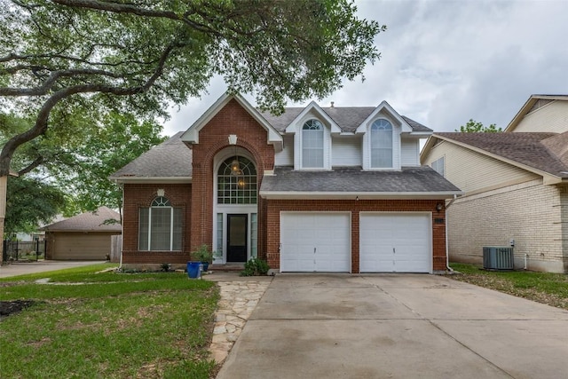 traditional-style home featuring driveway, roof with shingles, a garage, brick siding, and central AC
