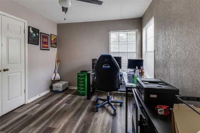 office featuring baseboards, a textured wall, ceiling fan, and wood finished floors