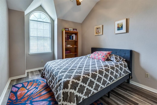bedroom with baseboards, a ceiling fan, wood finished floors, and vaulted ceiling