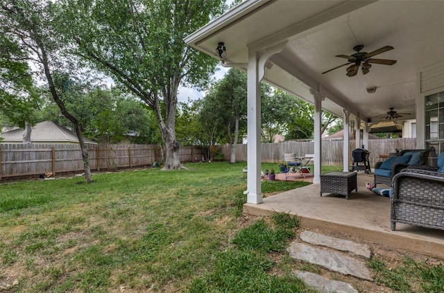 view of yard with a patio, outdoor lounge area, a ceiling fan, and a fenced backyard